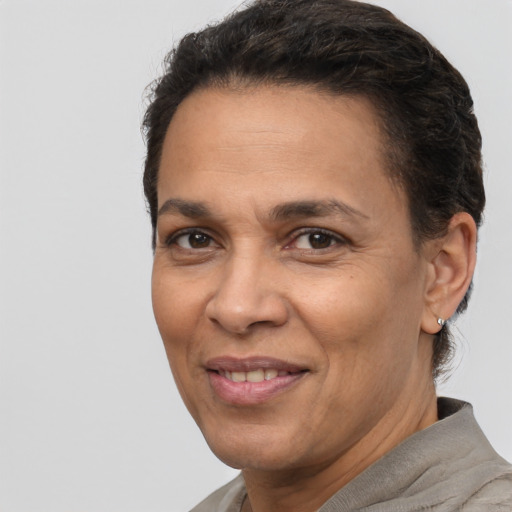 Joyful white adult female with short  brown hair and brown eyes