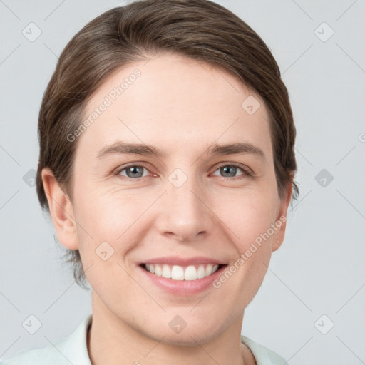 Joyful white young-adult female with short  brown hair and grey eyes