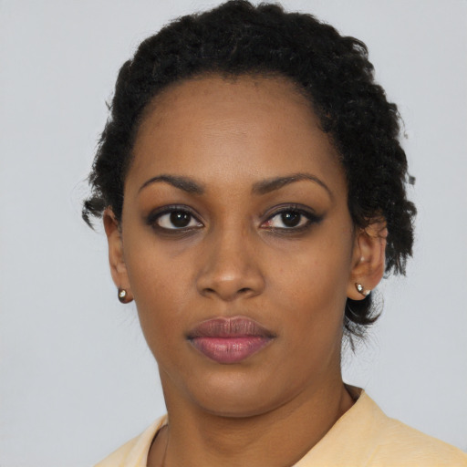 Neutral black young-adult female with short  black hair and brown eyes