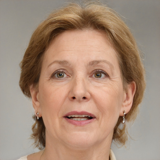 Joyful white middle-aged female with medium  brown hair and blue eyes