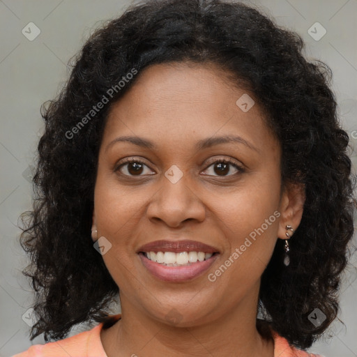 Joyful black young-adult female with medium  brown hair and brown eyes