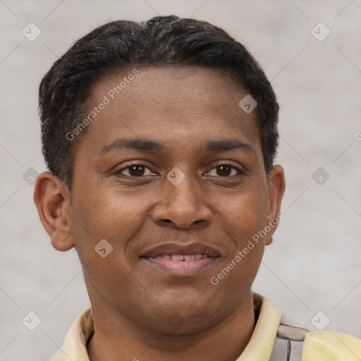 Joyful latino young-adult male with short  brown hair and brown eyes