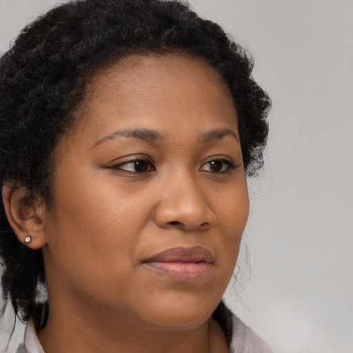 Neutral black young-adult female with long  brown hair and brown eyes