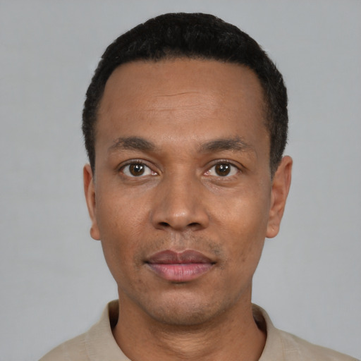 Neutral black young-adult male with short  black hair and brown eyes