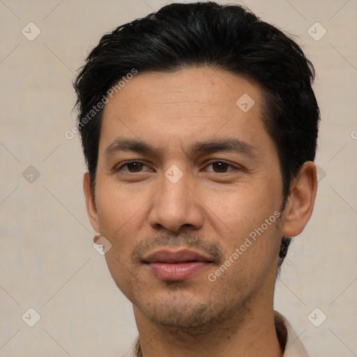 Joyful asian young-adult male with short  black hair and brown eyes