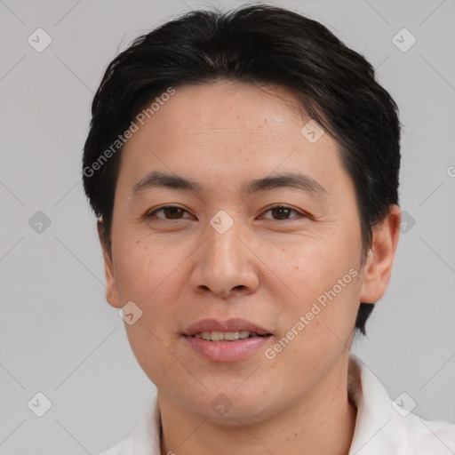 Joyful asian young-adult male with short  brown hair and brown eyes