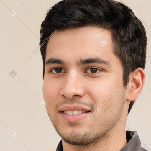 Joyful white young-adult male with short  black hair and brown eyes