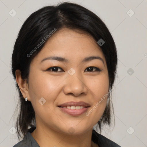 Joyful asian young-adult female with medium  brown hair and brown eyes