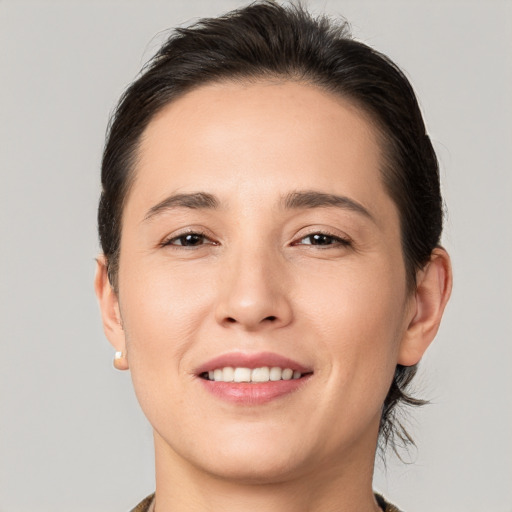 Joyful white young-adult female with medium  brown hair and brown eyes