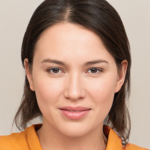 Joyful white young-adult female with medium  brown hair and brown eyes