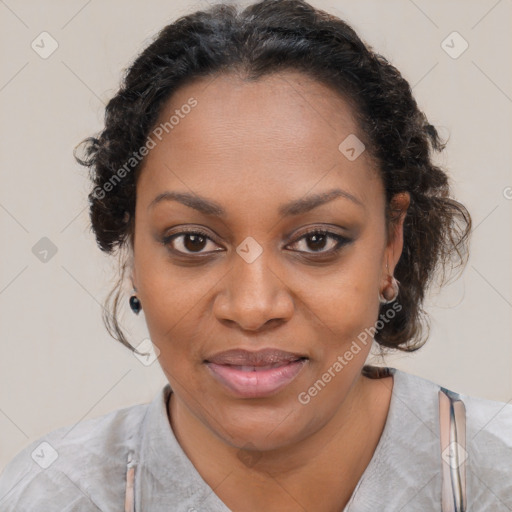 Joyful black adult female with medium  brown hair and brown eyes