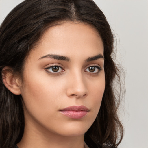 Neutral white young-adult female with long  brown hair and brown eyes