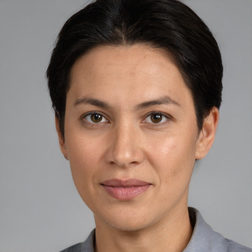 Joyful white adult female with short  brown hair and brown eyes