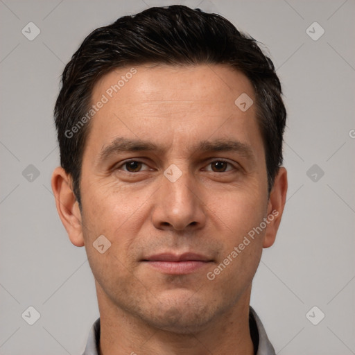 Joyful white adult male with short  brown hair and brown eyes