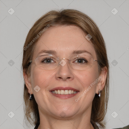 Joyful white adult female with medium  brown hair and grey eyes