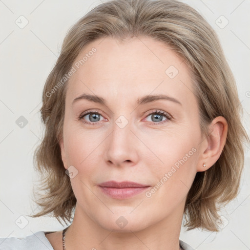 Joyful white young-adult female with medium  brown hair and blue eyes