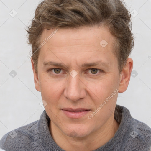 Joyful white adult male with short  brown hair and grey eyes