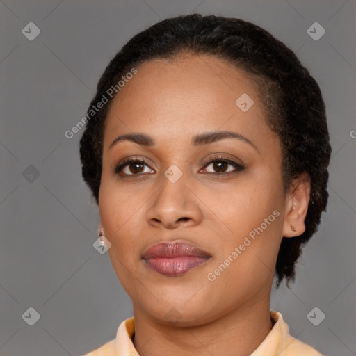 Joyful black young-adult female with short  brown hair and brown eyes