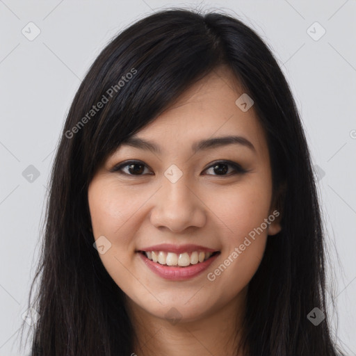 Joyful latino young-adult female with long  brown hair and brown eyes