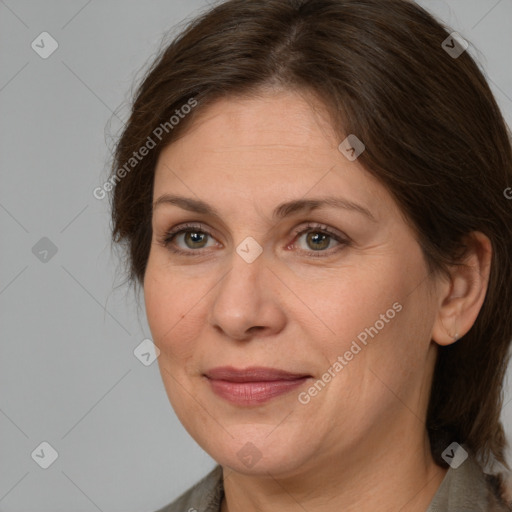 Joyful white adult female with medium  brown hair and brown eyes