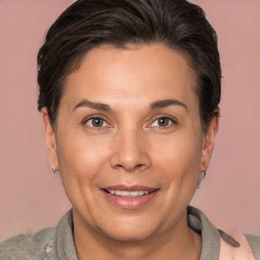 Joyful white adult female with short  brown hair and brown eyes