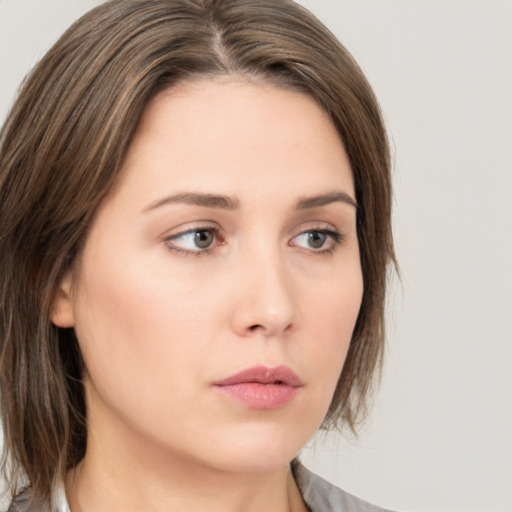 Neutral white young-adult female with medium  brown hair and grey eyes