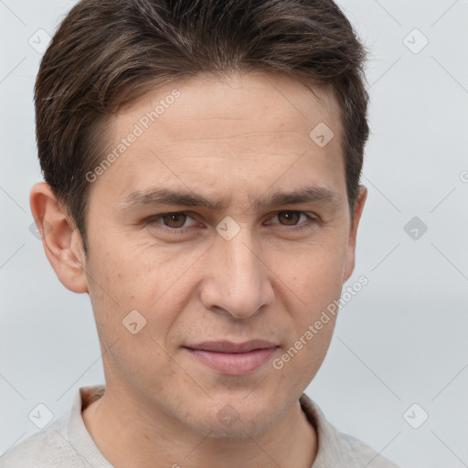 Joyful white adult male with short  brown hair and brown eyes