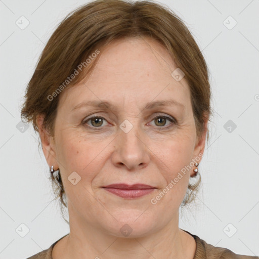 Joyful white adult female with medium  brown hair and grey eyes