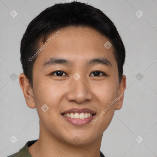 Joyful asian young-adult male with short  black hair and brown eyes