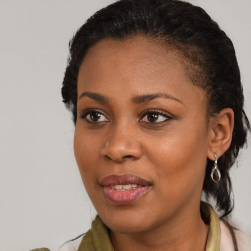 Joyful black young-adult female with medium  brown hair and brown eyes