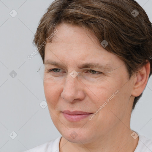 Joyful white adult female with short  brown hair and brown eyes