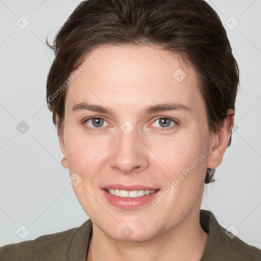 Joyful white young-adult female with medium  brown hair and grey eyes