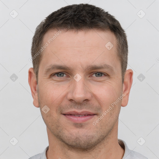 Joyful white adult male with short  brown hair and brown eyes