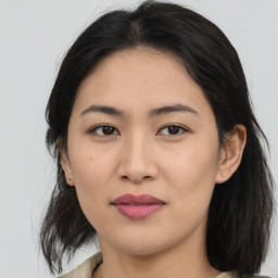 Joyful asian young-adult female with medium  brown hair and brown eyes