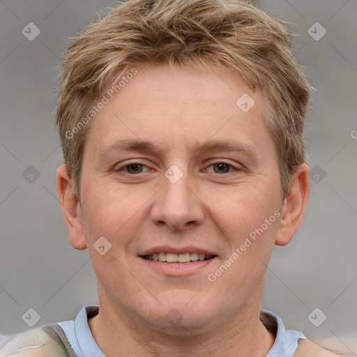 Joyful white adult male with short  brown hair and grey eyes