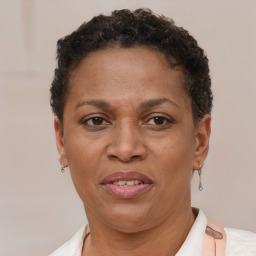 Joyful black adult female with short  brown hair and brown eyes