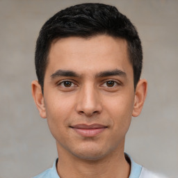 Joyful white young-adult male with short  black hair and brown eyes