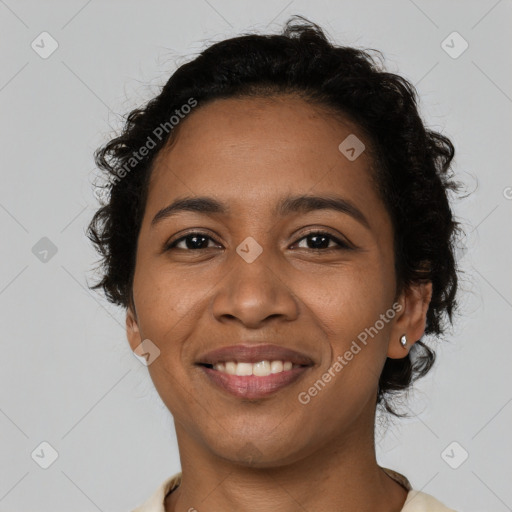 Joyful latino young-adult female with short  brown hair and brown eyes