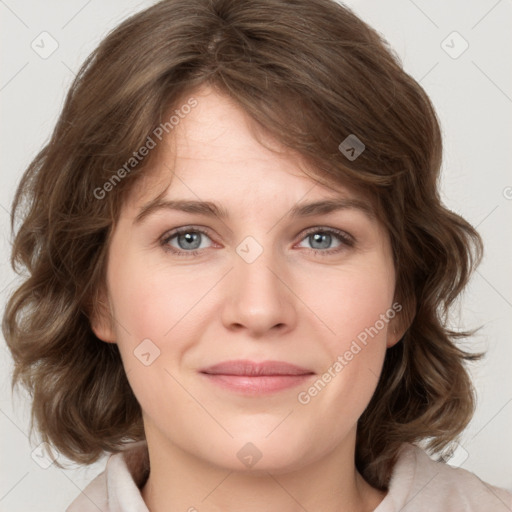 Joyful white young-adult female with medium  brown hair and green eyes