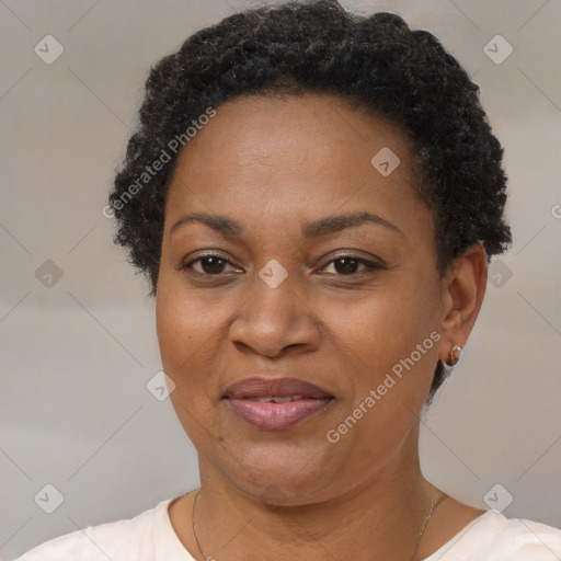 Joyful black adult female with short  brown hair and brown eyes