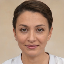 Joyful white young-adult female with short  brown hair and brown eyes