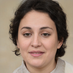 Joyful white adult female with medium  brown hair and brown eyes