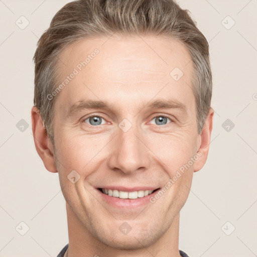 Joyful white adult male with short  brown hair and grey eyes