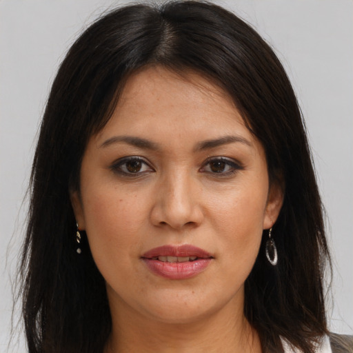 Joyful white young-adult female with long  brown hair and brown eyes