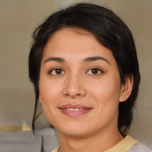 Joyful asian young-adult female with medium  brown hair and brown eyes