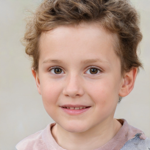 Joyful white child male with short  brown hair and grey eyes