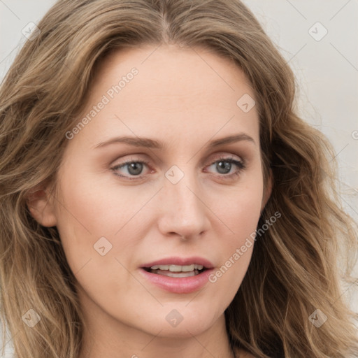 Joyful white young-adult female with long  brown hair and blue eyes