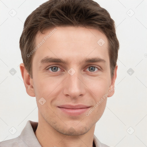 Joyful white young-adult male with short  brown hair and grey eyes