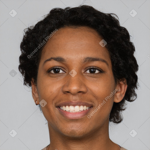 Joyful black young-adult female with short  black hair and brown eyes