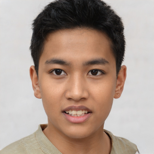 Joyful asian young-adult male with short  black hair and brown eyes